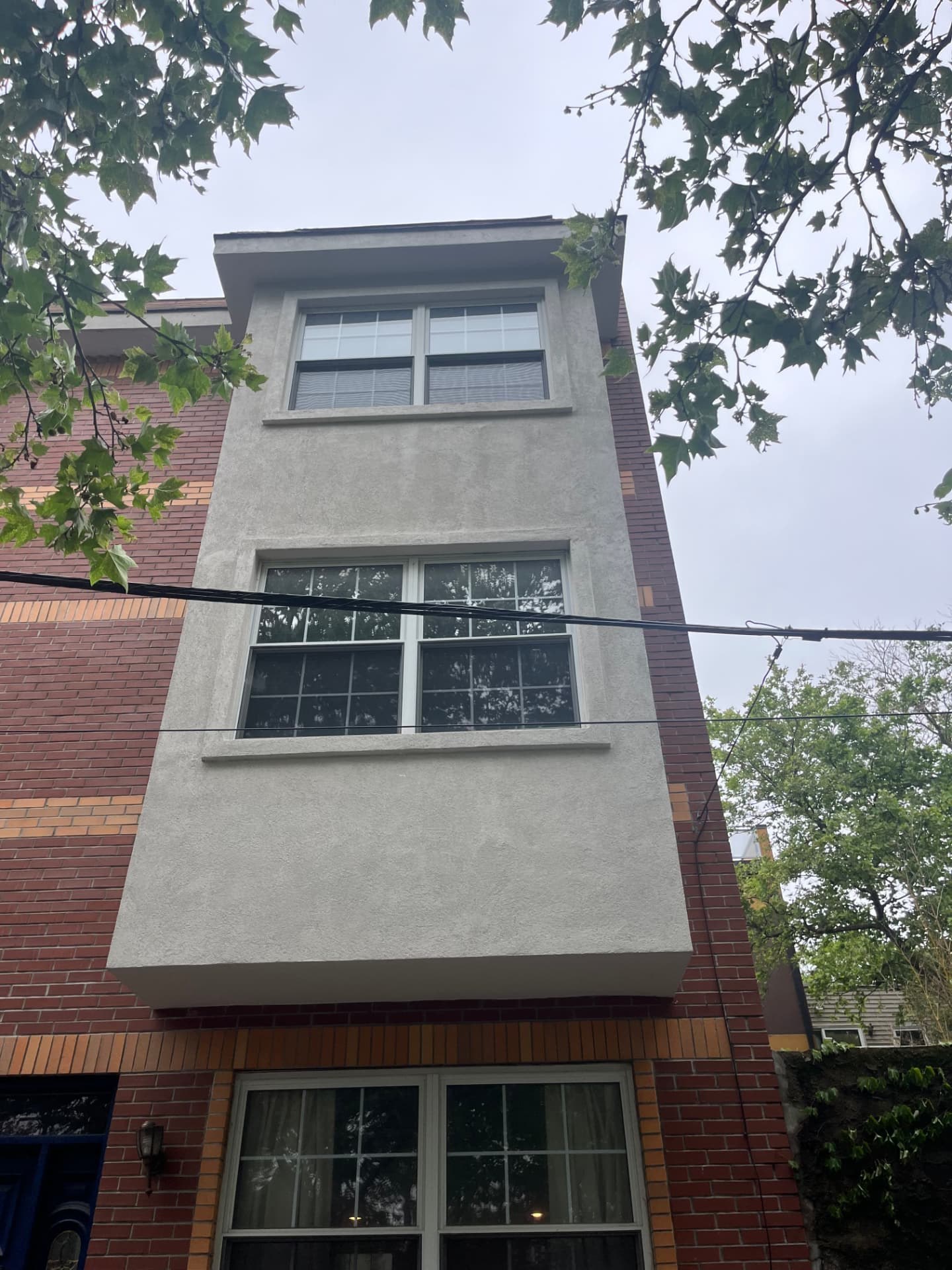 Upscale stucco and stone home exterior restored by SMG Plastering INC in Media, PA